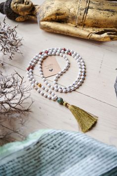 Spiritual jewelry, mala, jewelry, necklaces, 108 beads, mantra mala, chakra healing, tassel necklace, gift for him, calm the mind, hand made mala, yoga mala beads. ----- FREE SHIPPING -------  This listing is for ONE mala necklace. This healing mala necklace features 108 beads (6mm) of Howlite Mookaite + Agate(guru). Whether as a calming meditation guide or a beautiful, neutral, and natural statement piece, this necklace will be a great addition to your spiritual practice. GEMSTONE PROPERTIES: - Spiritual Tassel Necklace With 108 Round Beads, White 108 Beads Mala For Meditation, White Mala With 8mm Beads For Rituals, Spiritual White Necklace For Rituals, Spiritual White Necklaces For Rituals, Bohemian White Beads As A Gift, Bohemian White Beads For Gifts, White Bohemian Beads For Gifts, White Healing Mala With 108 Beads