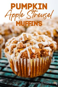 muffins with icing on top sitting on a cooling rack