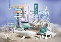 an assortment of items displayed on display in a store window, including a scooter and shark