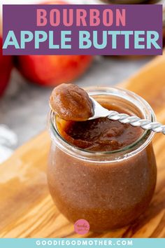 an apple butter in a glass jar with a spoon sticking out of it and text overlay reading bourbon apple butter