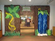 an office hallway decorated with paper mache and jungle scene for the door decorating contest