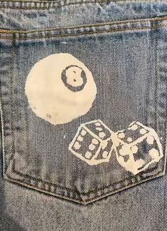 the back pocket of a pair of jeans with stickers on it