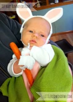 a baby wearing bunny ears holding a carrot in its arms with the caption, diy baby bunny costume