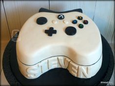 a cake with a controller on top of it