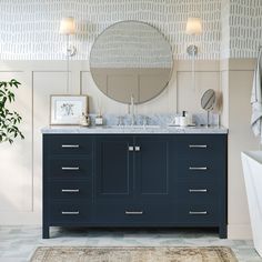 a bathroom with a large mirror above the sink and a rug on the floor next to it