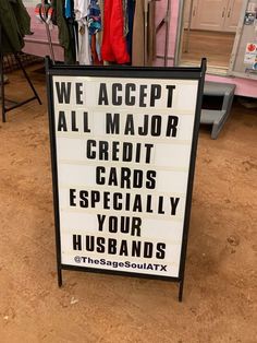 a sign that says we accept all major credit cards especially your husbands