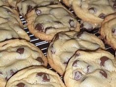 chocolate chip cookies are cooling on a rack