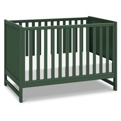 a green crib with white sheets on the bottom and side rails, in front of a white background