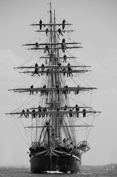 a black and white photo of an old sailing ship