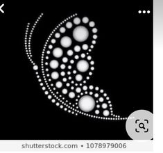 an abstract white design on black background with circles and dots in the shape of a crescent