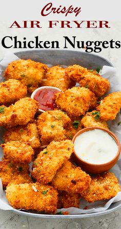 fried chicken nuggets with ranch dressing in a serving dish and dipping sauce on the side