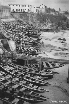 many boats are lined up on the beach