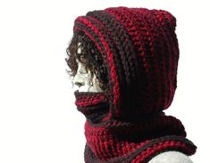 a crocheted hat and scarf on top of a mannequin's head