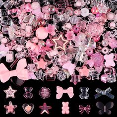 a pile of assorted pink and clear plastic bows, brooches, and buttons