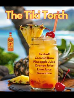 the tiki torch cocktail is served in a mason jar with a cherry and pineapple garnish