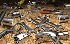 there are many wrenches and other tools on the table