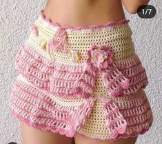 a close up of a person wearing shorts with crochet on the bottom and side