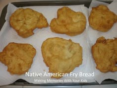 some fried food is sitting on top of white paper and ready to be cooked in the oven