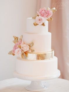 a white wedding cake with pink flowers on it's top and the words instagram