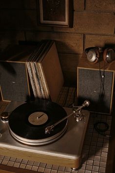 a record player sitting on top of a wooden table