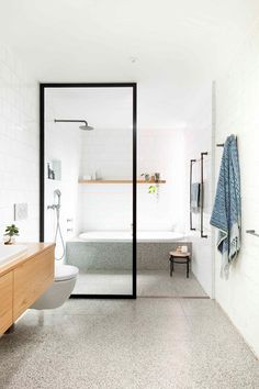 a bathroom with a bathtub, toilet and sink