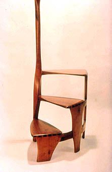 a wooden chair that is shaped like a giraffe