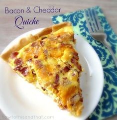 a piece of bacon and cheddar quiche on a plate with a fork