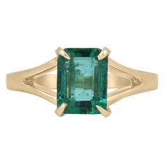 Enthrall in this stunning solitaire natural emerald ring. The gemstone showcases a fine quality Zambian emerald cut emerald with superb qualities such as excellent luster and transparency, as some of many. Set in a 14K yellow gold solitaire, four-prong setting, with a split shank and satin gold finish. Setting Style: Prong Setting Material: 14K Yellow Gold Setting Weight: 3.5 Grams Main Stone: Emerald Shape: Emerald Cut Weight: 1.36-Carats Clarity: Transparent Color: Deep Vivid Green Luster: Exc Brushed Gold Ring, Emerald Solitaire Ring, Emerald Cut Solitaire, Gold Emerald Ring, Colombian Emerald Ring, Natural Emerald Rings, Emerald Ring Gold, Yellow Gold Solitaire, Zambian Emerald