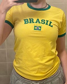 Details: Short-sleeve top with Brasil team graphical designTop Length: NormalSleeve Length: Short SleevesMaterials:95% Polyester + 5% Spandex Brasil Top, Brazil Shirt, Y2k Grunge Aesthetic, Graphical Design, Chic Prom Dresses, Crop Top Blouse, Sports Top, Casual Summer Outfits, Vintage Tops