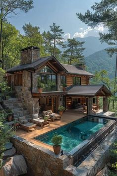 a pool in front of a house surrounded by trees and rocks with a stone wall