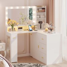 a white vanity with lights on it in a bedroom next to a bed and window