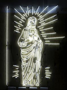 a lit up statue of the virgin mary