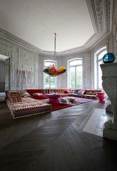 a living room filled with lots of colorful furniture