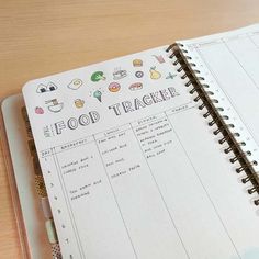 an open notebook with food tracker on it