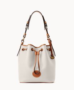 A Classic Drawstring    This timeless shoulder bag, made from innovative Italian pebble leather that's both lightweight and long-lasting, holds its shape when you set it down thanks to a structured bottom. Pebbled Leather Bucket Bag With Leather Handles, Monogram Pendant, Tan Cowhide, Bag Ideas, Dooney And Bourke, Dooney & Bourke Bags, Best Bags, Dooney & Bourke, Beautiful Bags