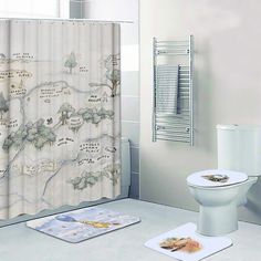 a bathroom with a toilet, shower curtain and rugs on the floor in front of it