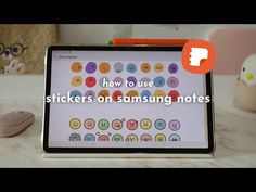 a tablet with the words how to use stickers on samsung notes in front of it