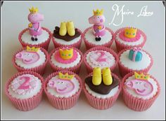 cupcakes decorated with pink and white frosting are arranged in the shape of animals