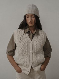 Composition : Tasmania wool 50%, Nylon 40%, Cashmere 5%, Camel 5%Color : BEIGE_FREECountry of Origin : Republic of Korea Beige Knit Vest Sweater, Trendy Beige Knit Vest, Chic Beige Knit Vest, Beige Sleeveless Knit Vest, Luxury Beige Knit Vest, Cable Knit Vest, Knit Vest, Cable Knit, Camel