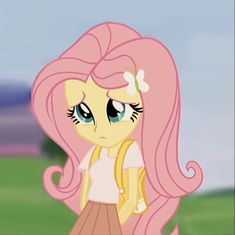 a pink pony with long hair and big eyes standing next to a green grass covered field