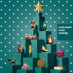 a christmas tree made out of boxes and other items is featured in the advert