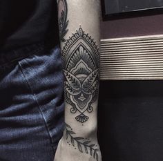 a person with a tattoo on their arm