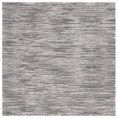 an area rug with grey and white stripes