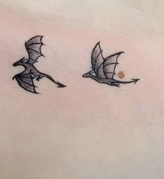 two flying birds on the back of a woman's stomach