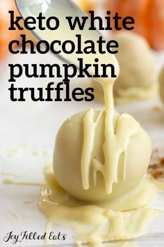 a white chocolate pumpkin truffles is being drizzled with caramel