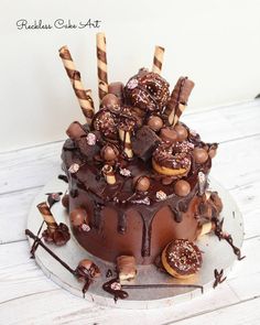 a cake with chocolate frosting and candies on top