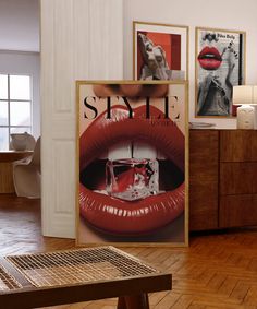 a living room filled with furniture and pictures on the wall