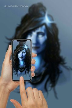 a person holding up a cell phone with an avatar on the screen in front of them