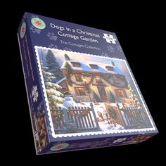 a puzzle box with a christmas house on it's front and the words dogs in a christmas cottage