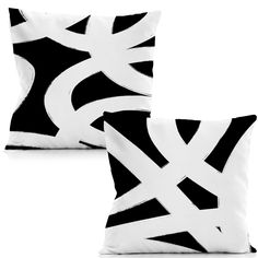 two black and white pillows sitting next to each other